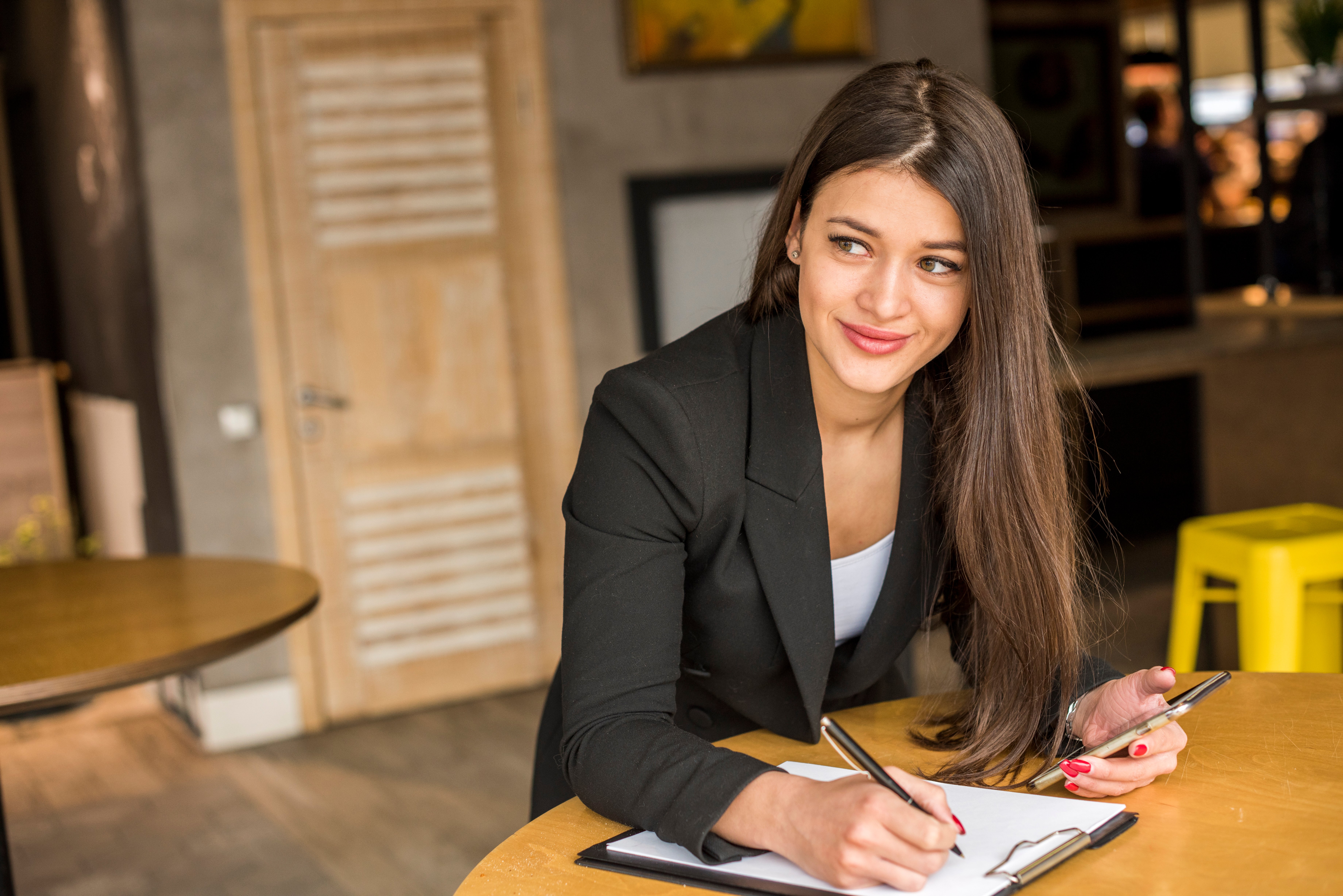 brunette-businesswoman-writing-document