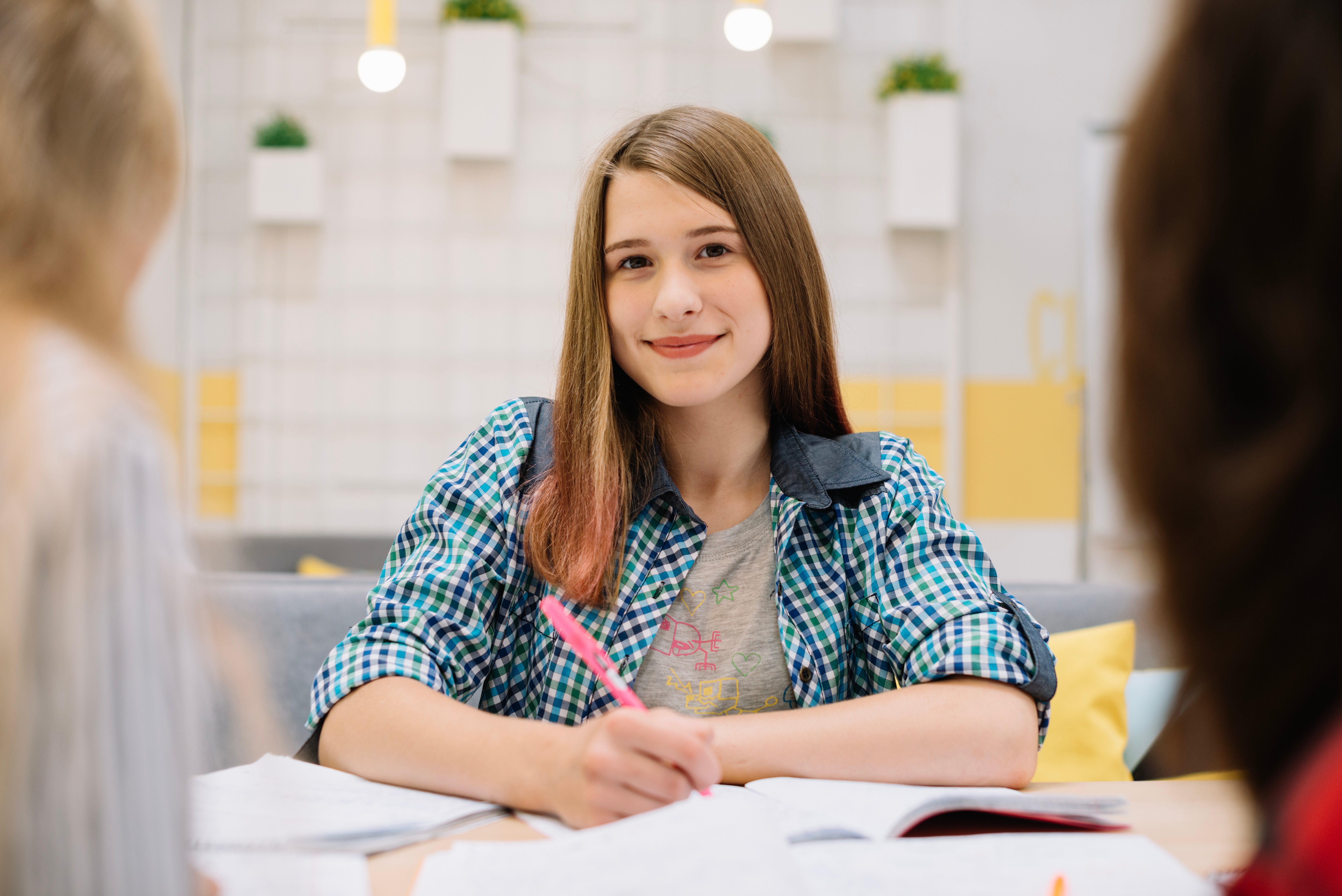 smiling-girl-studying-classroom